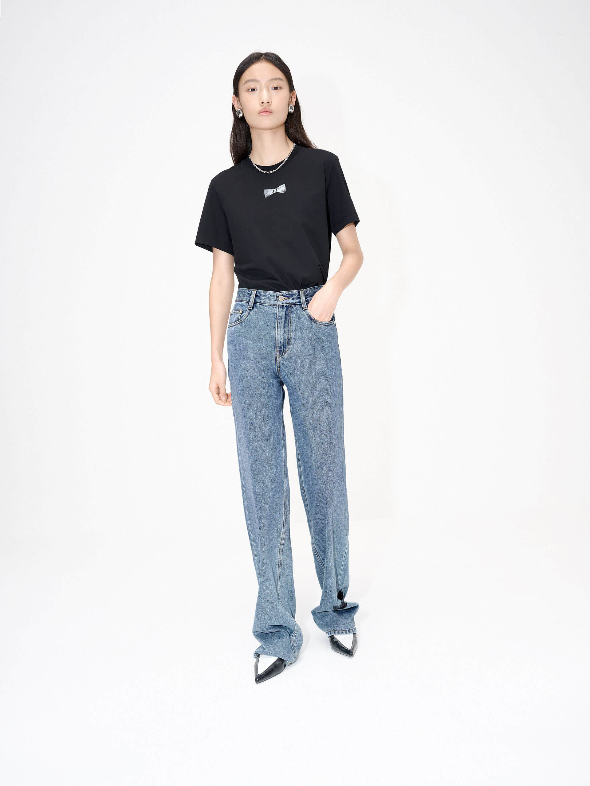 MO&Co. Women's Straight Bowknot Details Jeans in Blue. Featuring a high-waist design for a modern silhouette, these chic jeans are enhanced with bowknot-printed details at the back pocket and hem, adding a touch of femininity.