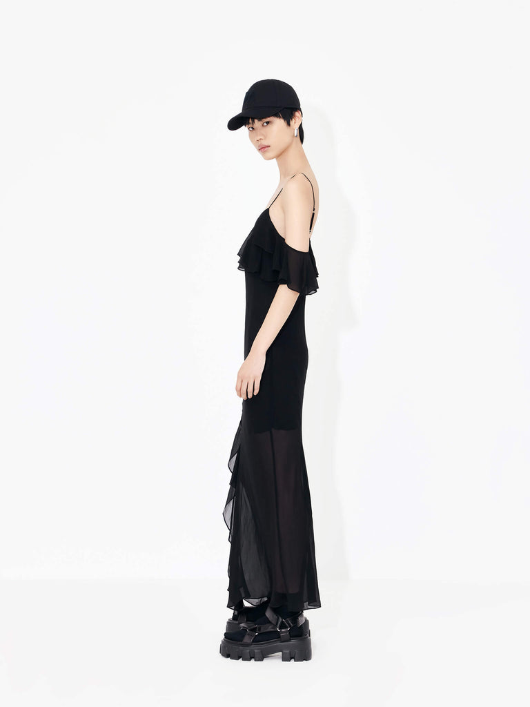 MO&Co. Women's Maxi Chiffon Slip Dress in Black features frill details, adjustable straps, cold shoulders, back slit detail, and recycled fiber material.