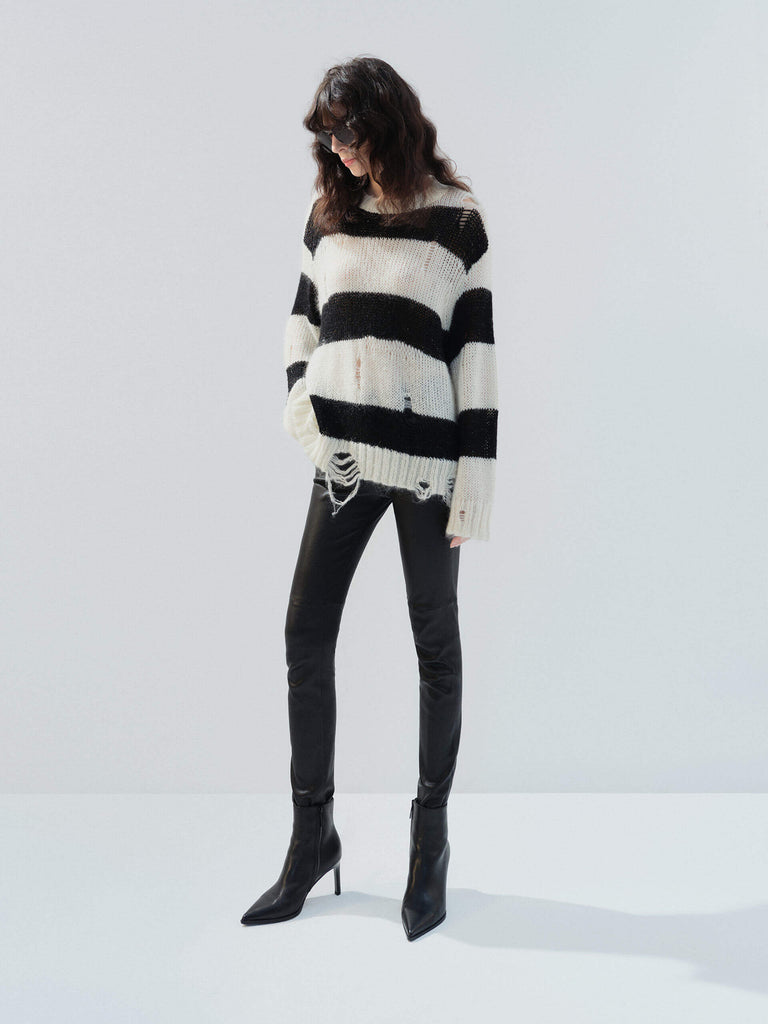 MO&Co. Noir Women's Distressed Detail Striped Oversized Pullover Crafted from a blend of mohair and wool, this sweater offers a fuzzy texture and distressed design for a modern twist. 