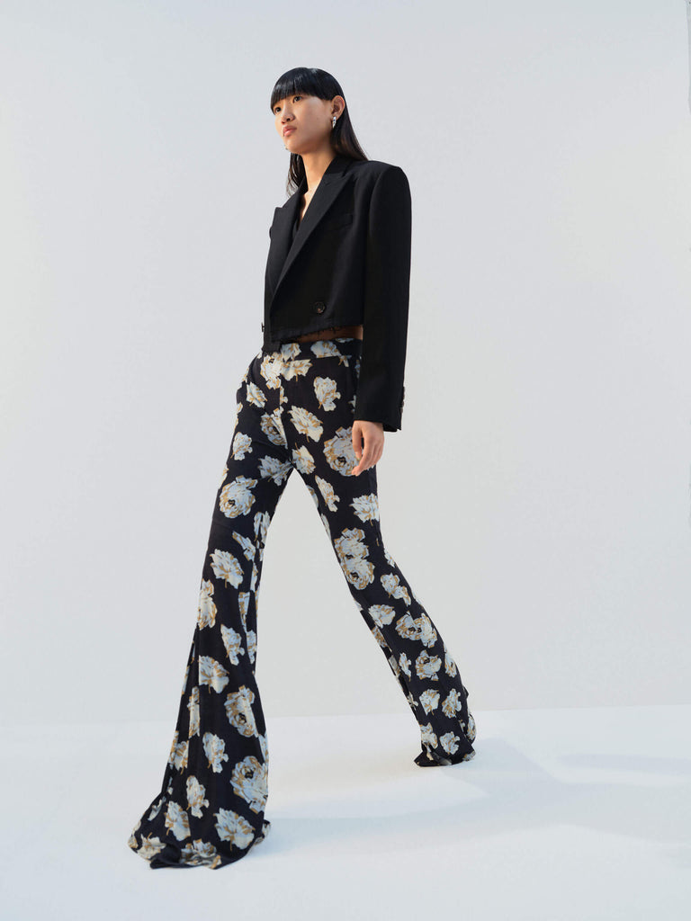 MO&Co. Noir Women's Floral Printed Full Length Flared Pants with a high waist, flared leg, comfy stretchy material, slanted pockets, and hook-and-bar closure, these pants offer both style and functionality.