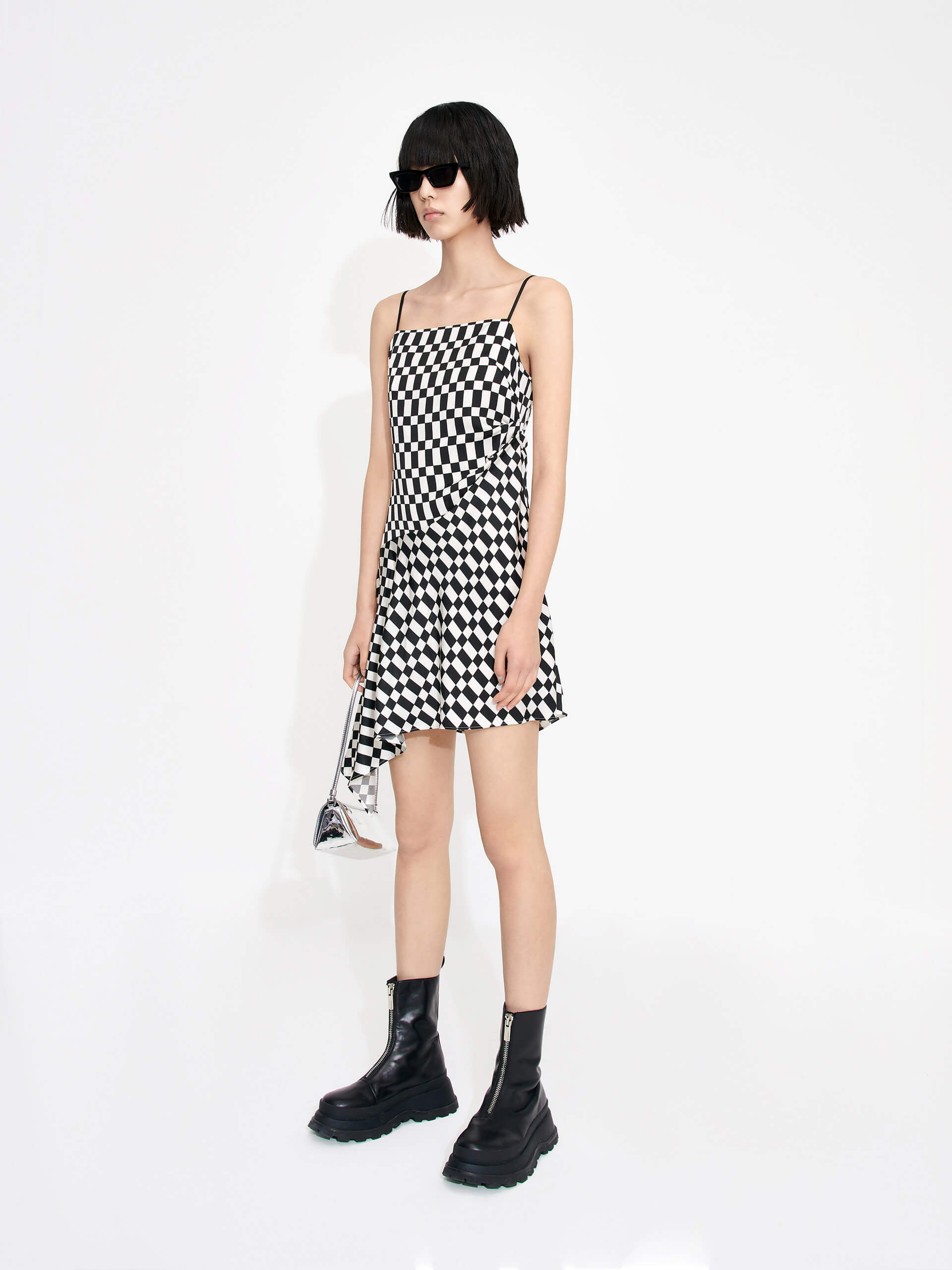 MO&Co. Women's Gathered Detail Asymmetric Plaid Mini Dress in Black and White features a straight neckline, mini length & asymmetric hem designs for a flattering fit. Pleated side sweeps add texture for an interesting look. Perfect for cocktail and evening out.