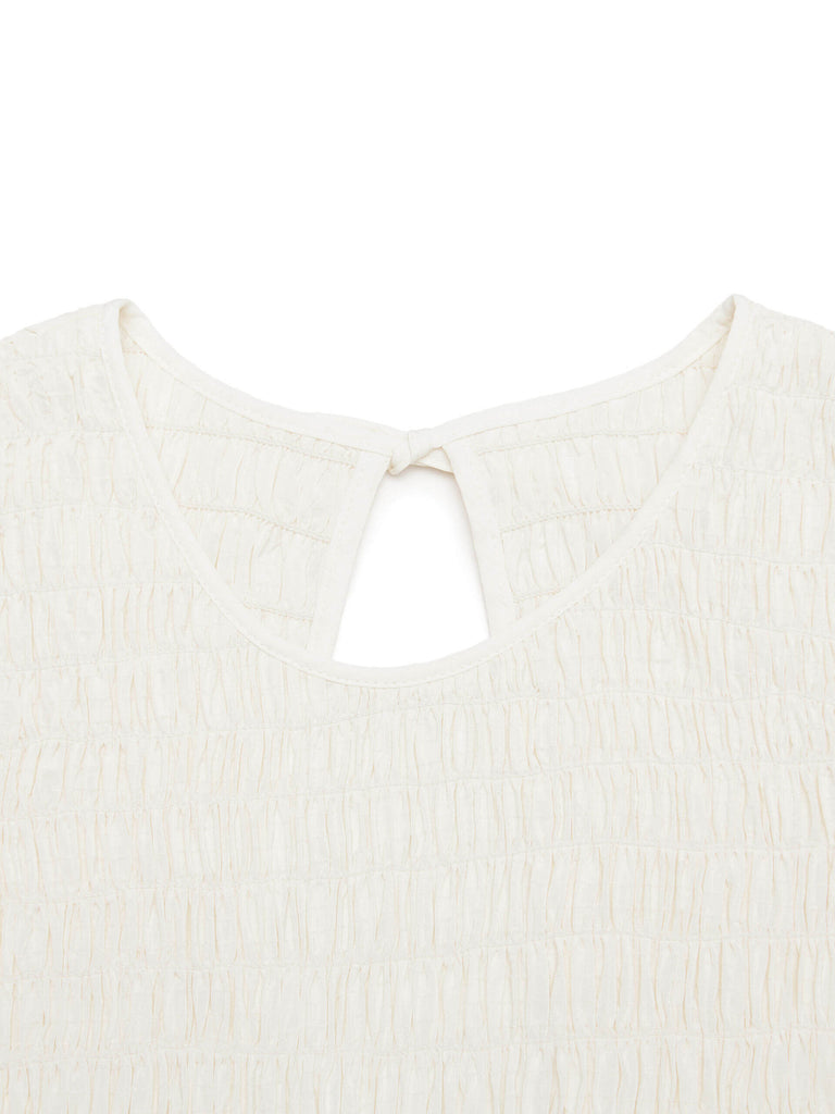 MO&Co. Women's Cut Shoulder Smocked Dress in Beige. It features smocked detailing and shoulder cutouts for a flattering look with a unique, modern feel. Plus crafted from a blend of silk and polyester for an ultra-comfortable fit.