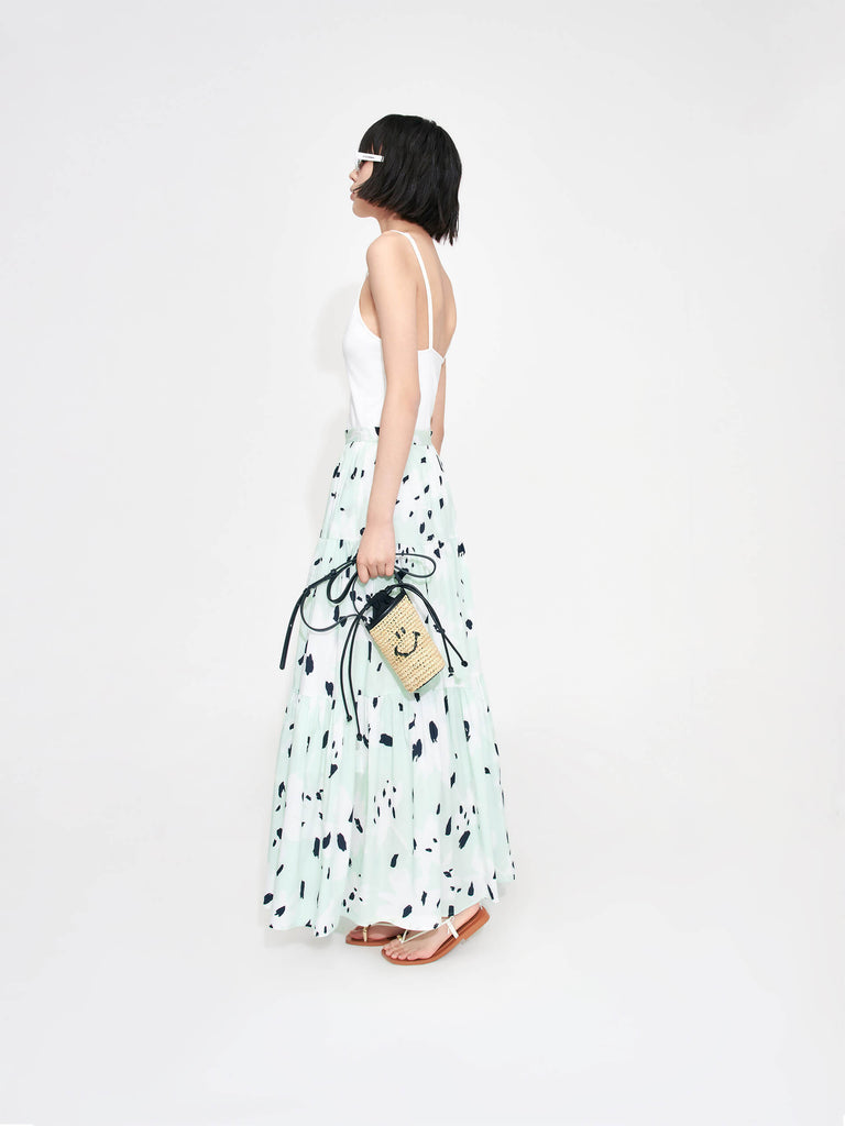 MO&Co. Women's Tiered Floral Print Maxi Skirt in Mint features a flowy fit, high waist and pleated design. Plus, the bold floral print and side zipper closure create a standout style.
