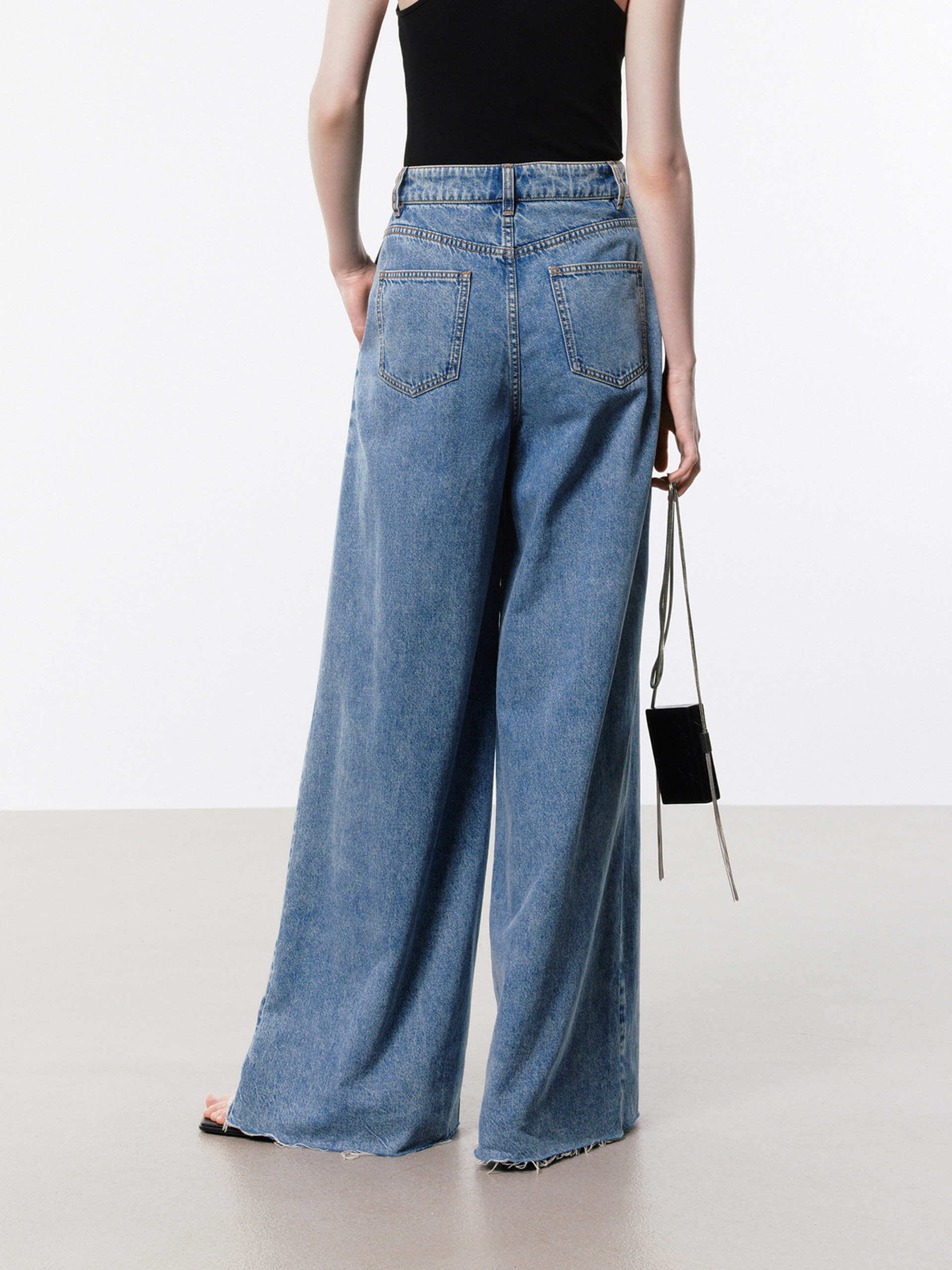 MO&Co. Women's Pleated Wide Leg Jeans in Blue with Belt Details