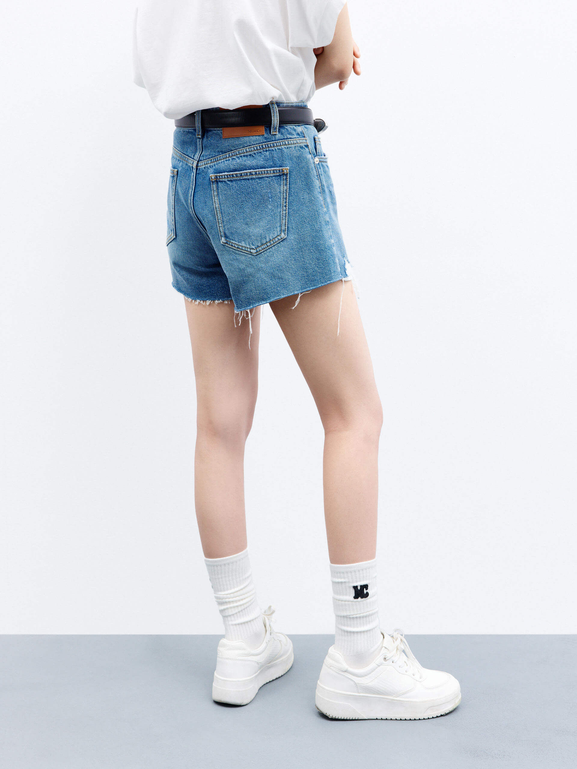 MO&Co. Women's Mid-rise Raw Hem Cotton Denim Shorts in Blue