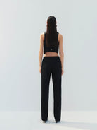 MO&Co. Noir Women's Tailored Straight Black Wool Suit Pants. The straight legs, full length design, hook-and-bar closure, and slanted pockets add to the tailored appeal of these versatile pants.