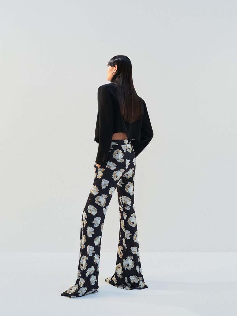 MO&Co. Noir Women's Floral Printed Full Length Flared Pants with a high waist, flared leg, comfy stretchy material, slanted pockets, and hook-and-bar closure, these pants offer both style and functionality.