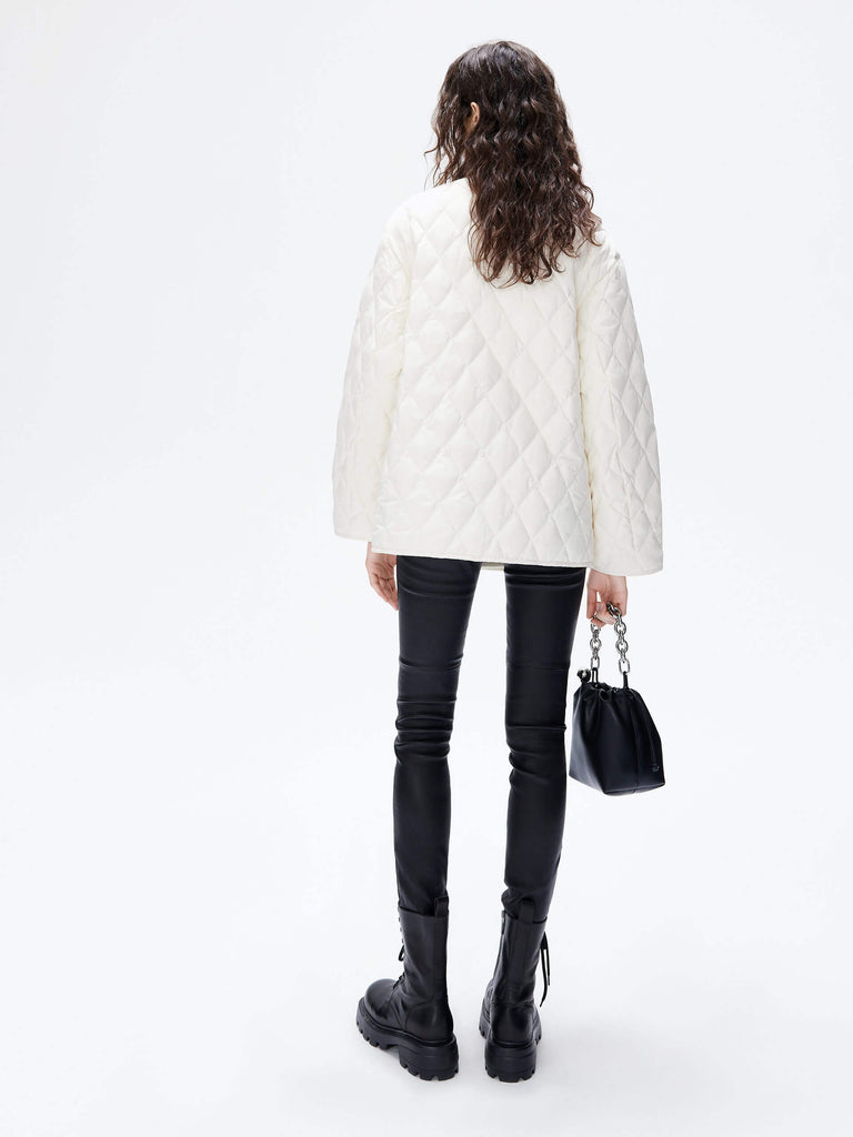 MO&Co. Women's V-neck Quilted Shell Wool Blend Jacket in White, featuring a button closure and flap pocket design. Wool panel front , quilted shell sleeves and back add a unique touch and extra warmth. 