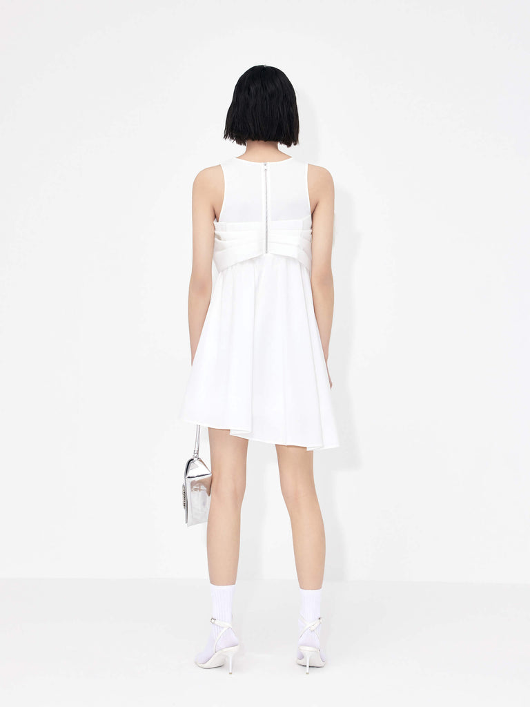 MO&Co. Bowknot Front Mini Dress in White with sleeveless design. Crafted from a soft and breathable cotton blend, this feminine and sophisticated piece features an a-line silhouette with bowknot front details for an eye-catching look.