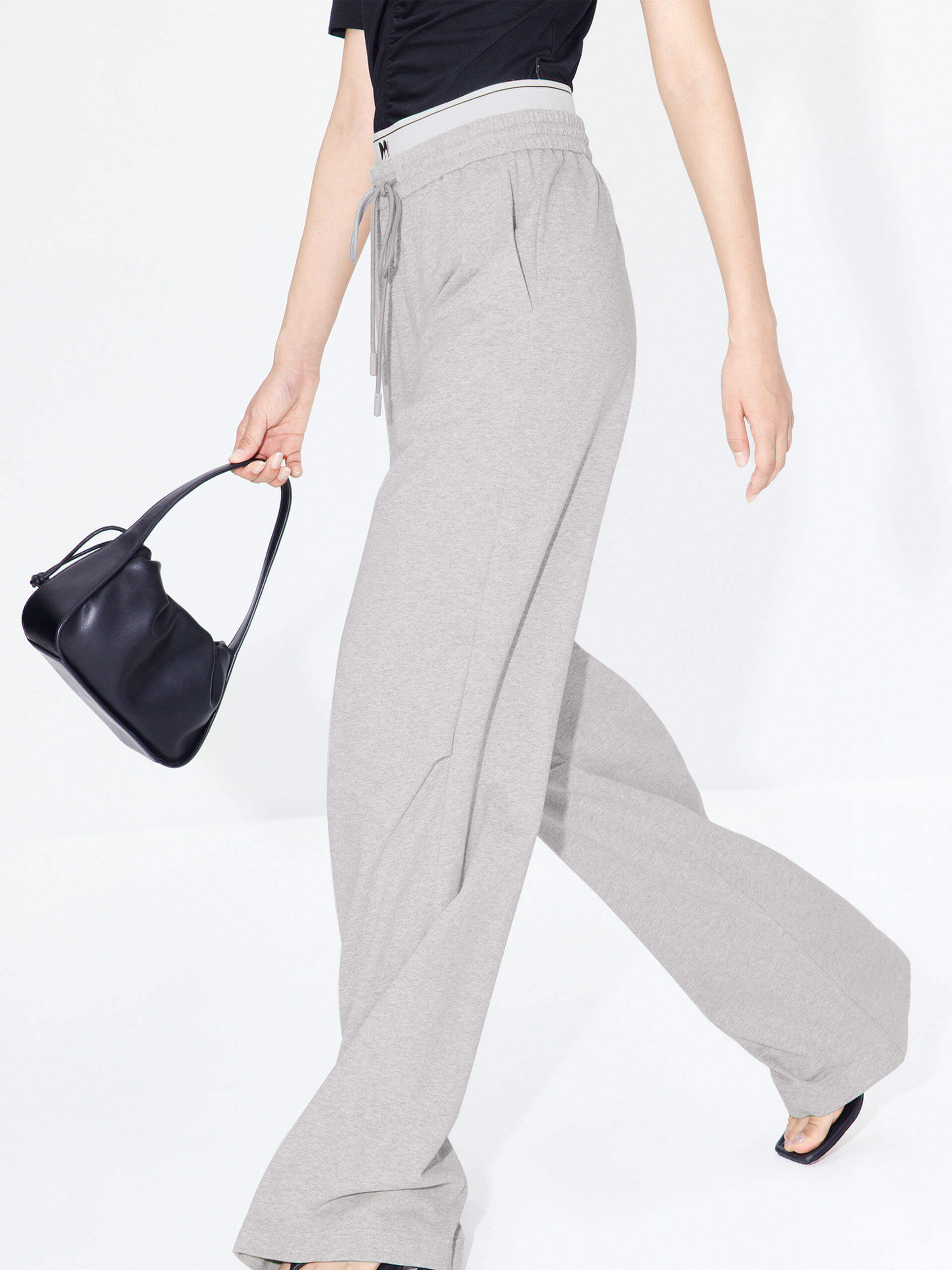 MO&Co. Women's Double Waistband Wide-leg Casual Trousers in Cotton - Grey. Made from breathable cotton fabric, these sweatpants offer a relaxed, stylish fit complete with wide legs & slant pockets. Contrast double waistbands & letter details give them added style.