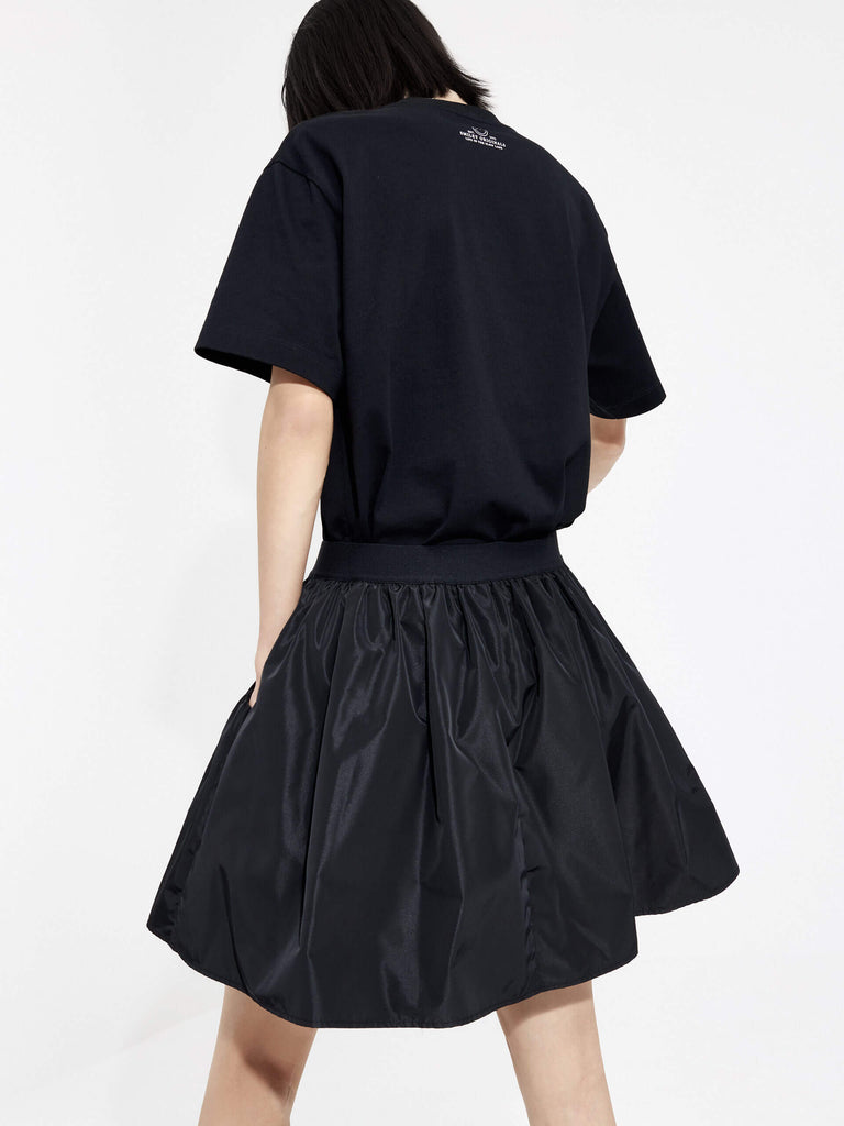 MO&Co. Women's Elastic Waist Pleated Mini Full Skirt in Black. Crafted with a high-waisted fit, this mini skirt flatters any figure and its stiff and smooth fabric ensures all-day chicness. Additional features include elastic waistband in woven M pattern design and double-side pocket.