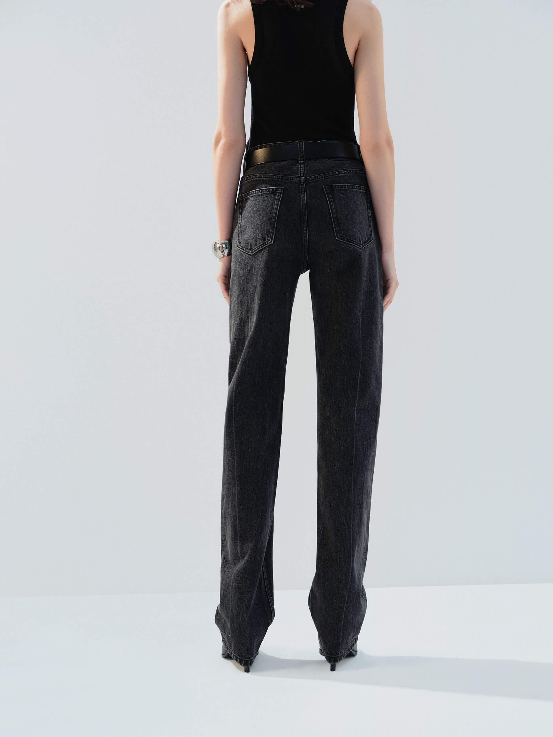 MO&Co. Noir Women's High Waist Black Straight Jeans Cotton features a regular fit, straight leg, and full length, these jeans also offer a button fly, five-pocket design, and a chic side-washed faded effect. 