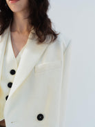 MO&Co. Women's Cropped Double-Breasted Luxury Wool Blazer in Cream with padded shoulders