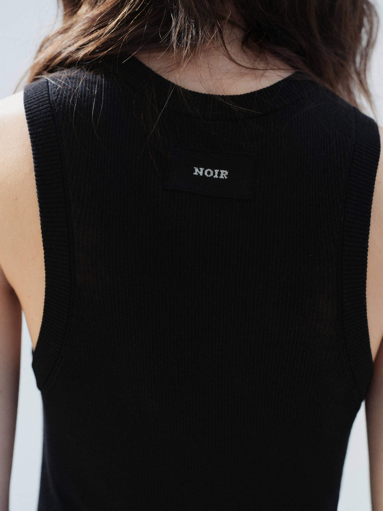 MO&Co. Noir Women's Black Ribbed Tank Top in Black | Versatile and Stylish crafted from a soft organic cotton-blend jersey with a slim stretchy ribbed tight fit. 