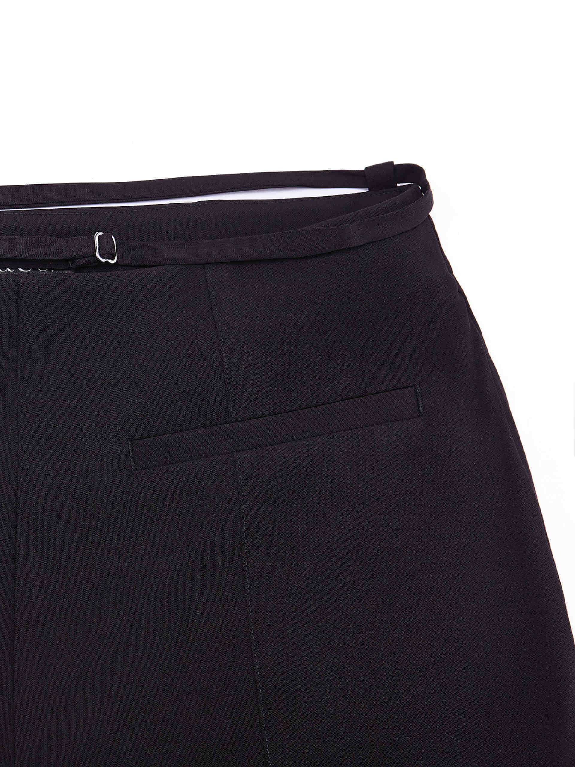 MO&Co. Women's Deconstructed Flared Pants in Black. Crafted from a lightweight, smooth acetate blend fabric, these pants feature a concealed side zipper, high waist with strap details and a seam detail along the front.