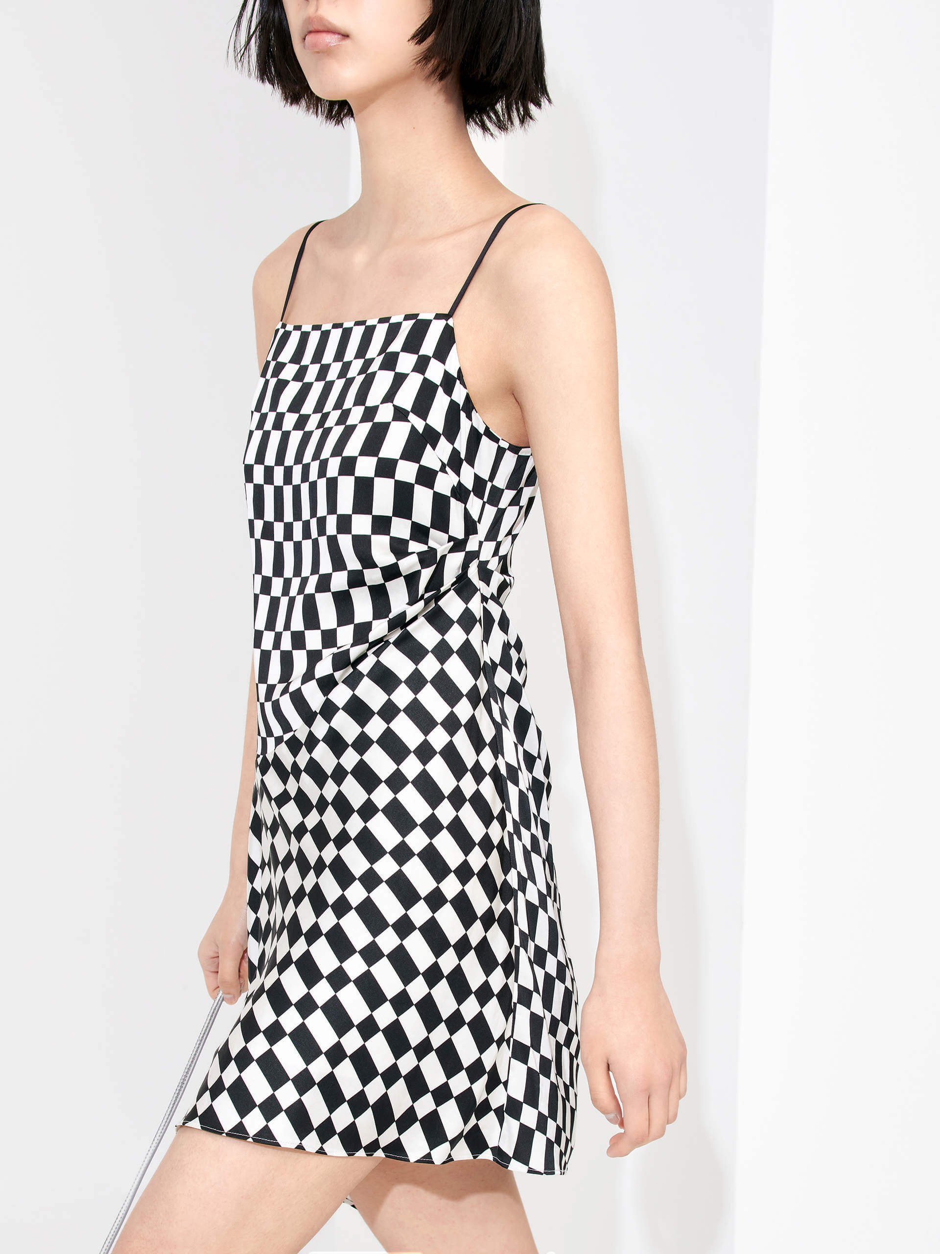 MO&Co. Women's Gathered Detail Asymmetric Plaid Mini Dress in Black and White features a straight neckline, mini length & asymmetric hem designs for a flattering fit. Pleated side sweeps add texture for an interesting look. Perfect for cocktail and evening out.