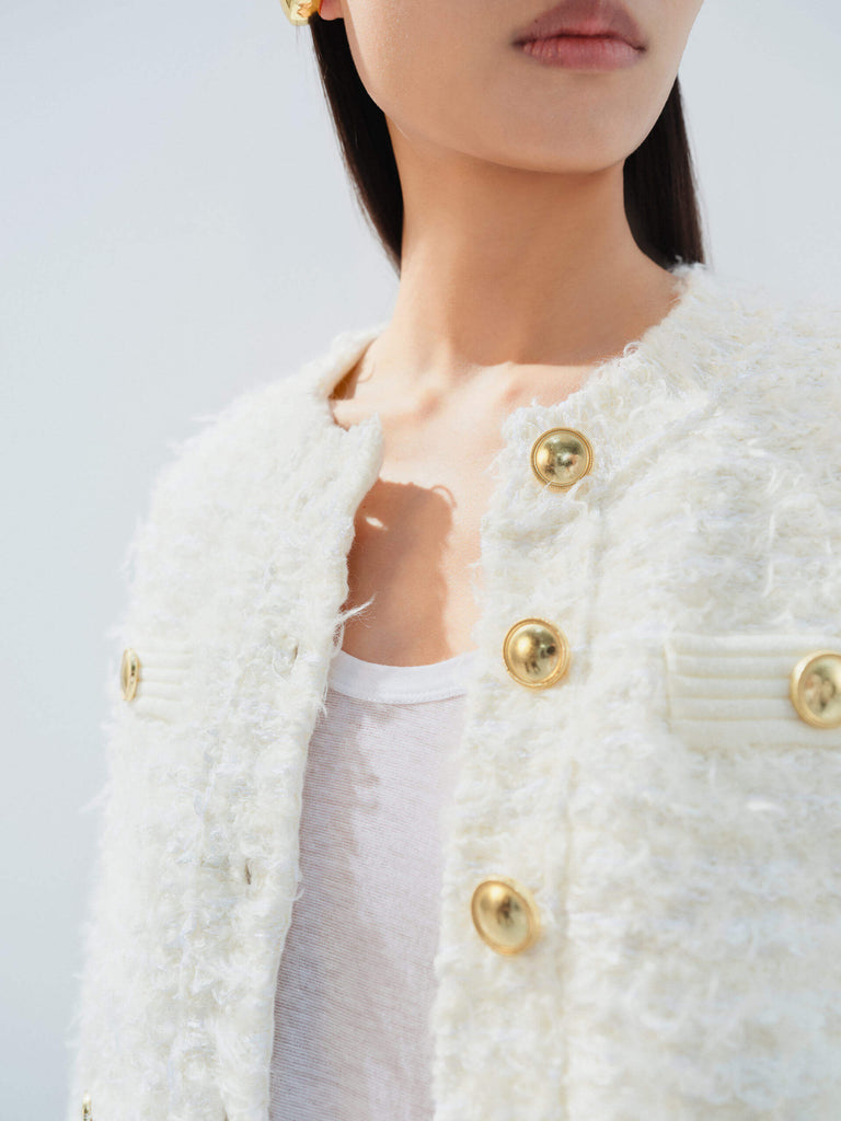 MO&Co. Noir Women's Metal Button Cropped Cardigan Beige features a shaggy texture and a cropped, boxy silhouette.