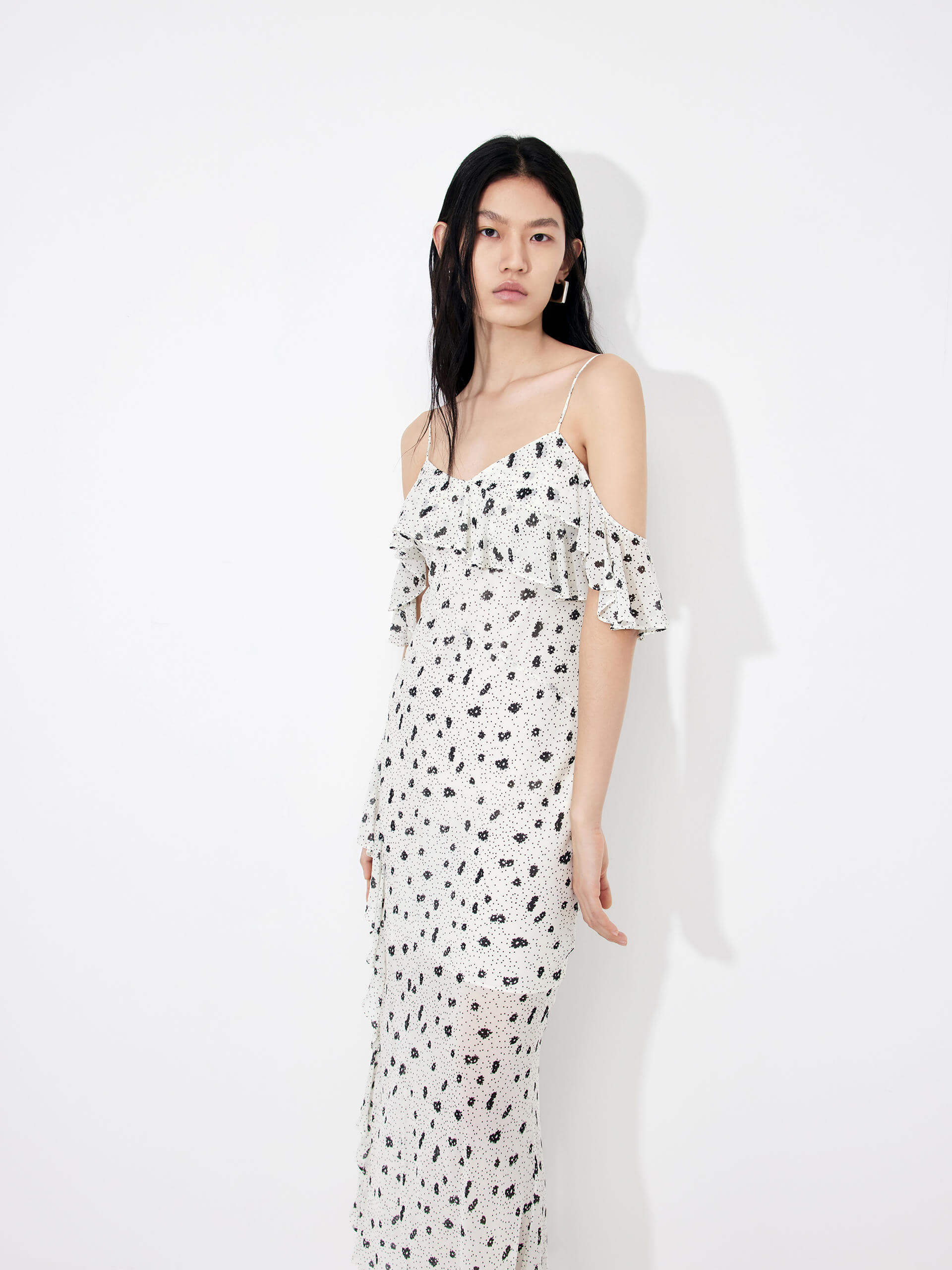 MO&Co. Women's Polka Dot Tulle Slip Dress in White features eye-catching frill details, floral/polka-dot print, adjustable straps and a front slit combine to make a stand-out look for your wardrobe.