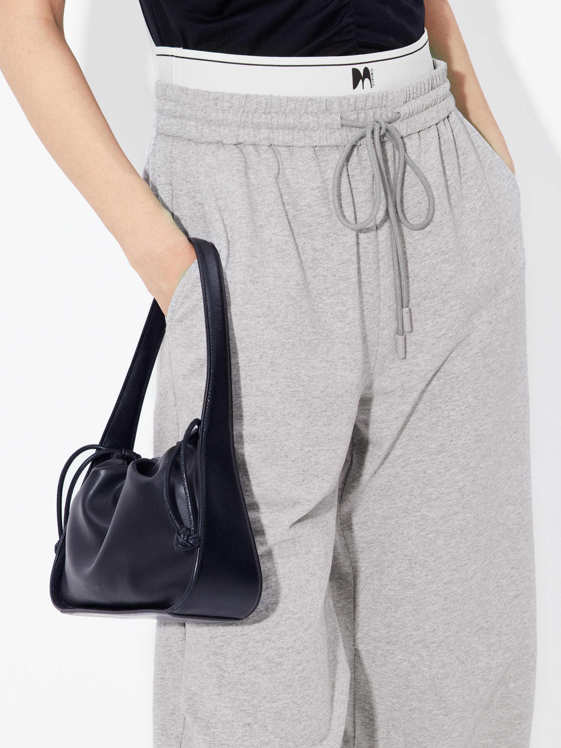 MO&Co. Women's Double Waistband Wide-leg Casual Trousers in Cotton - Grey. Made from breathable cotton fabric, these sweatpants offer a relaxed, stylish fit complete with wide legs & slant pockets. Contrast double waistbands & letter details give them added style.