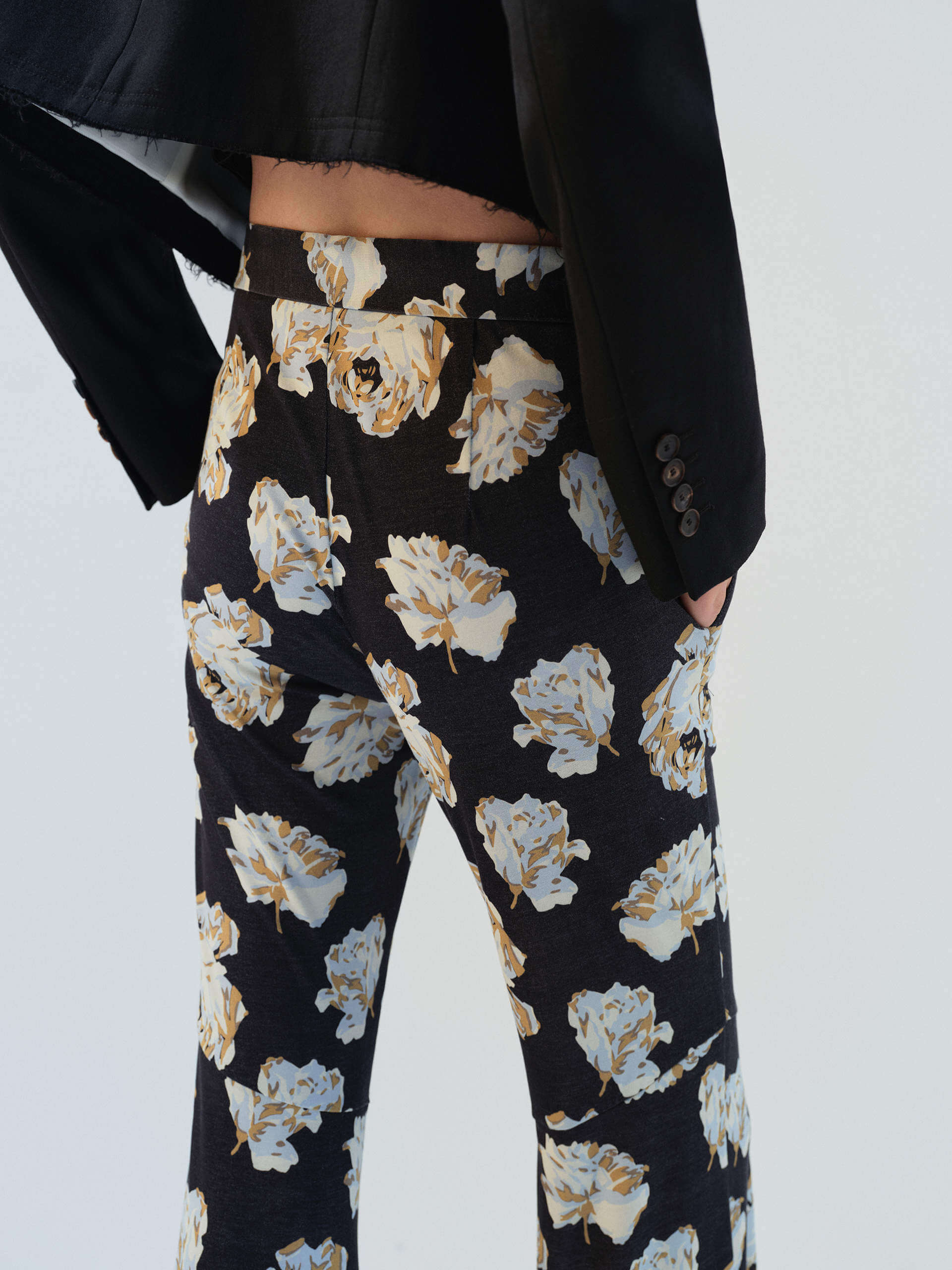 MO&Co. Noir Women's Floral Printed Full Length Flared Pants with a high waist, flared leg, comfy stretchy material, slanted pockets, and hook-and-bar closure, these pants offer both style and functionality.