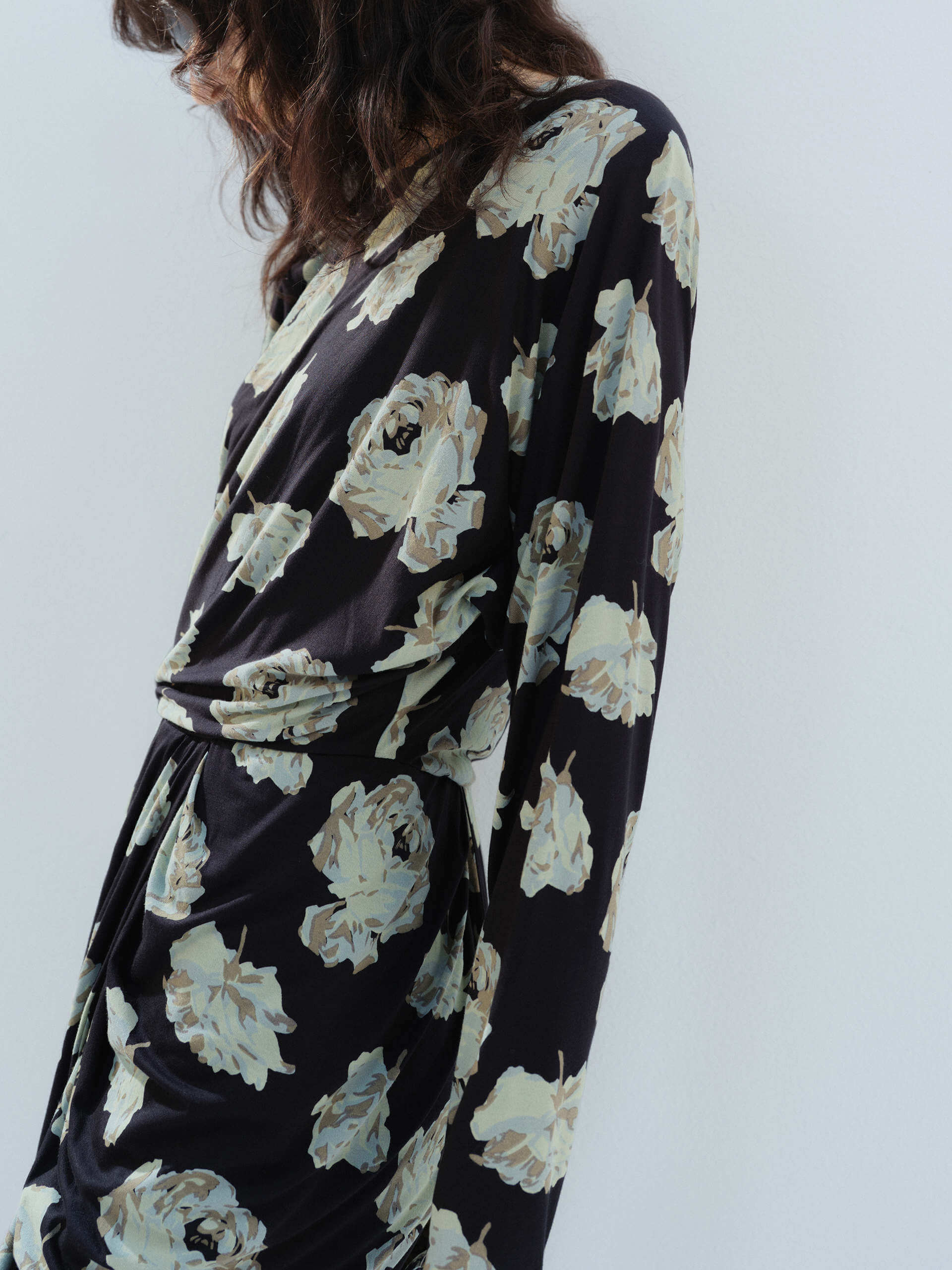 MO&Co. Noir Women's Floral Printed Long Sleeves Retro Mini Dress with padded shoulders, and a draped, ruched front.