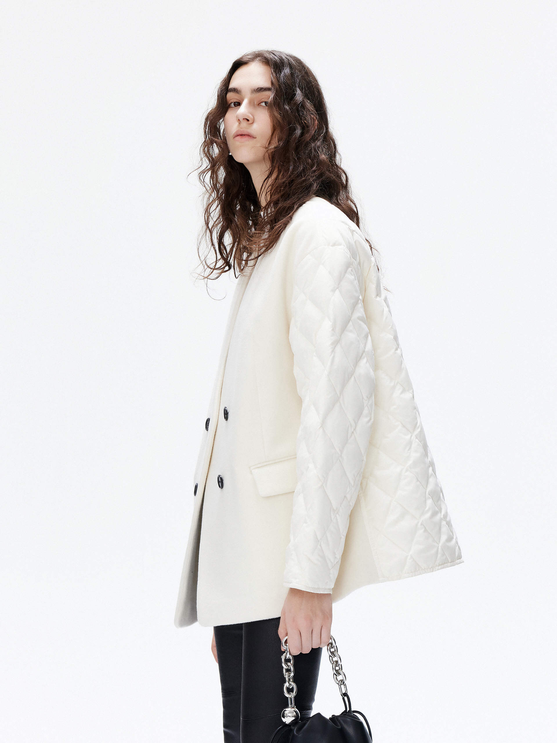 MO&Co. Women's V-neck Quilted Shell Wool Blend Jacket in White, featuring a button closure and flap pocket design. Wool panel front , quilted shell sleeves and back add a unique touch and extra warmth. 