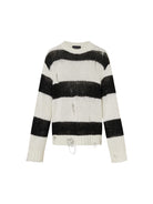 MO&Co. Noir Women's Distressed Detail Striped Oversized Pullover Crafted from a blend of mohair and wool, this sweater offers a fuzzy texture and distressed design for a modern twist. 