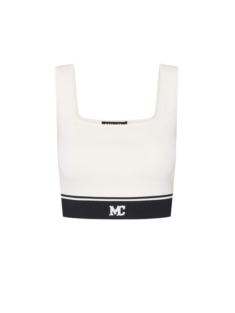 MO&Co. Women's Cropped Tank Top with Stretchy in White. Featuring a 50.9% viscose blend with a hint of stretch, squared neckline, a chic cropped silhouette & contrast palette with an "MC" logo.