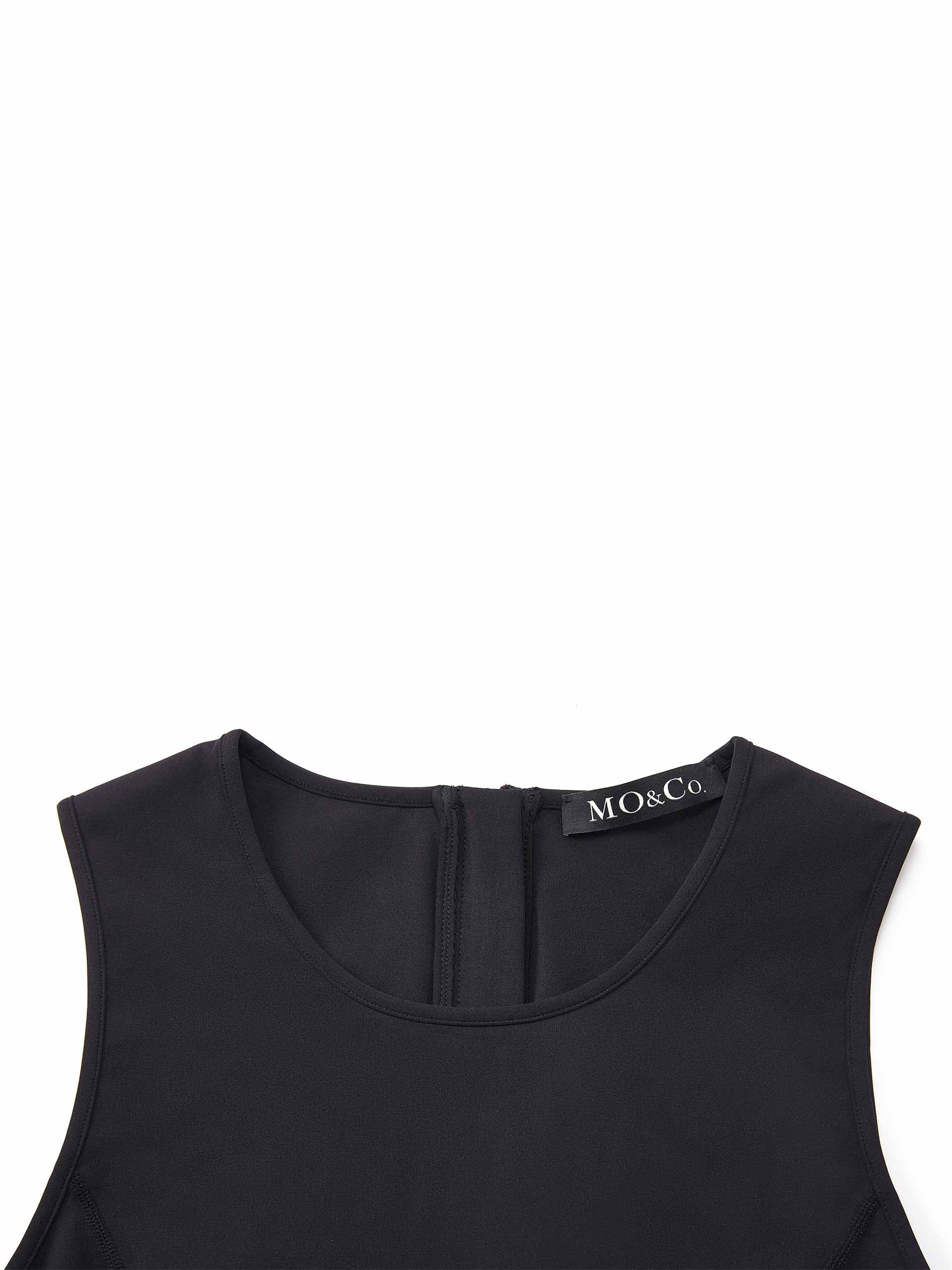 MO&Co. Women's Deconstructed Strap Detail Cropped Top in Black with arm sleeve cuffs