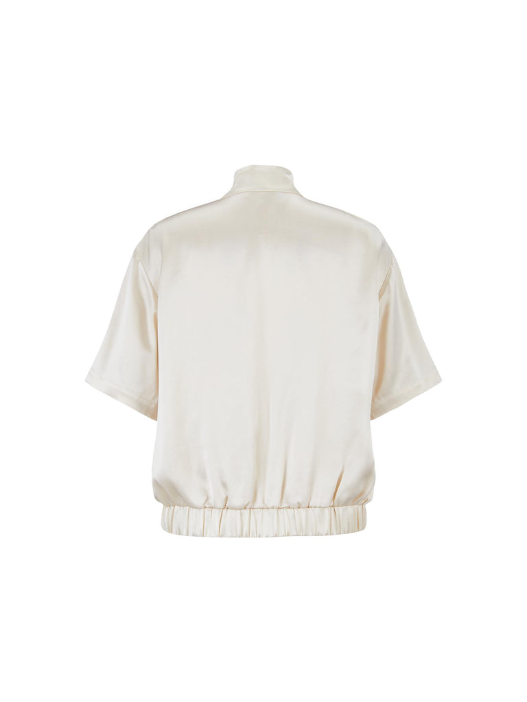 MO&Co. Women's Satin Acetate Blend Casual Track Jacket in Short Sleeves in Beige. Features: Loose fit, contrasting trim design, elasticized hem, side pockets & zip closure, and an acetate blend fabric for softness & comfort. 
