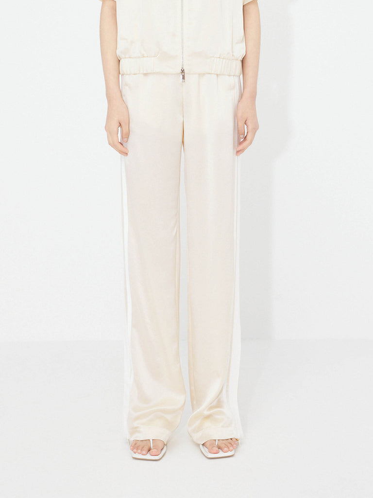 MO&Co. Women's Contrast Elastic Waist Pants in Beige feature a straight leg, contrast trim design, and an elasticated waistband with side pockets. An acetate blend fabric ensures these pants are incredibly soft, smooth, and comfortable.