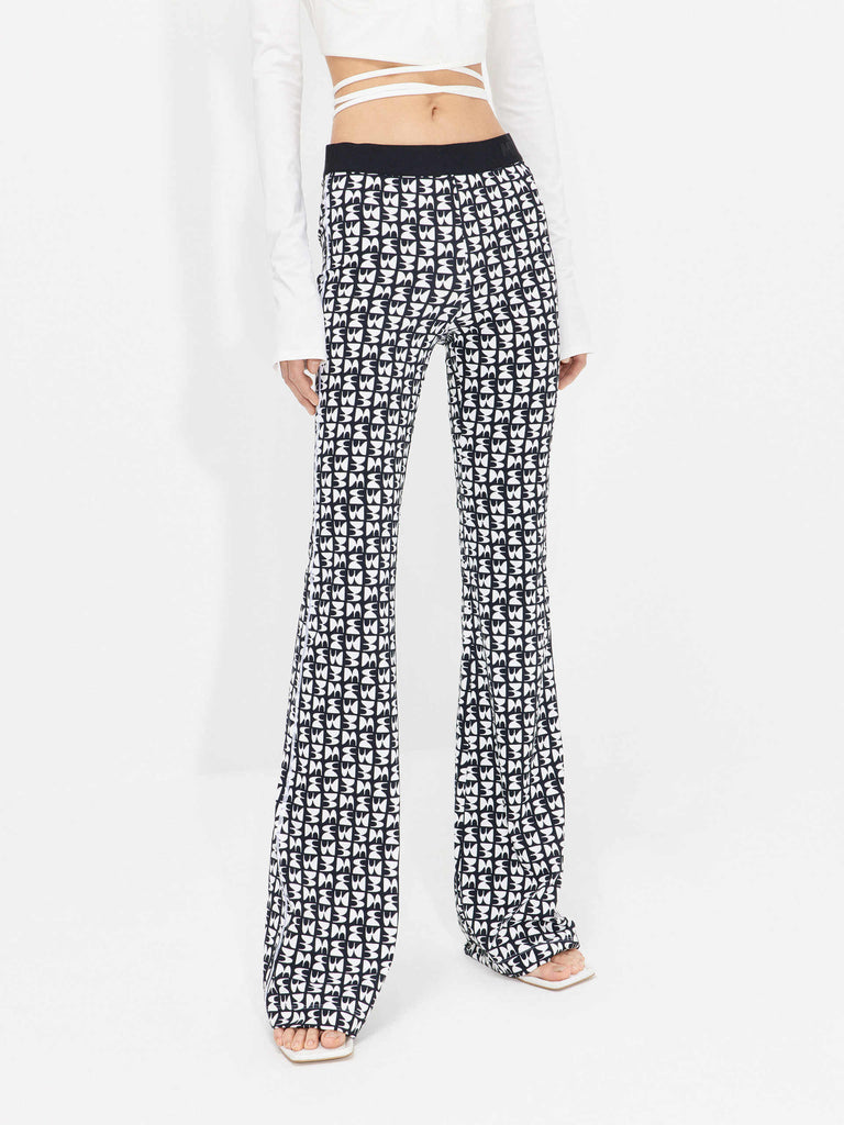 Discover MO&Co.'s Women's Monogram Print Flared Pants in Black and White - Allover print, elasticated waist with logo details and a comfy fit.