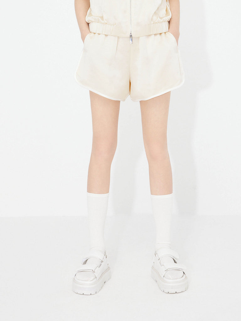 MO&Co. Women's Acetate Blend Contrast Track Shorts in Beige feature a stylish athleisure silhouette, contrasting trim design, an elasticized waistband, and slant pockets--all constructed from a soft, smooth, and comfy acetate blend fabric.