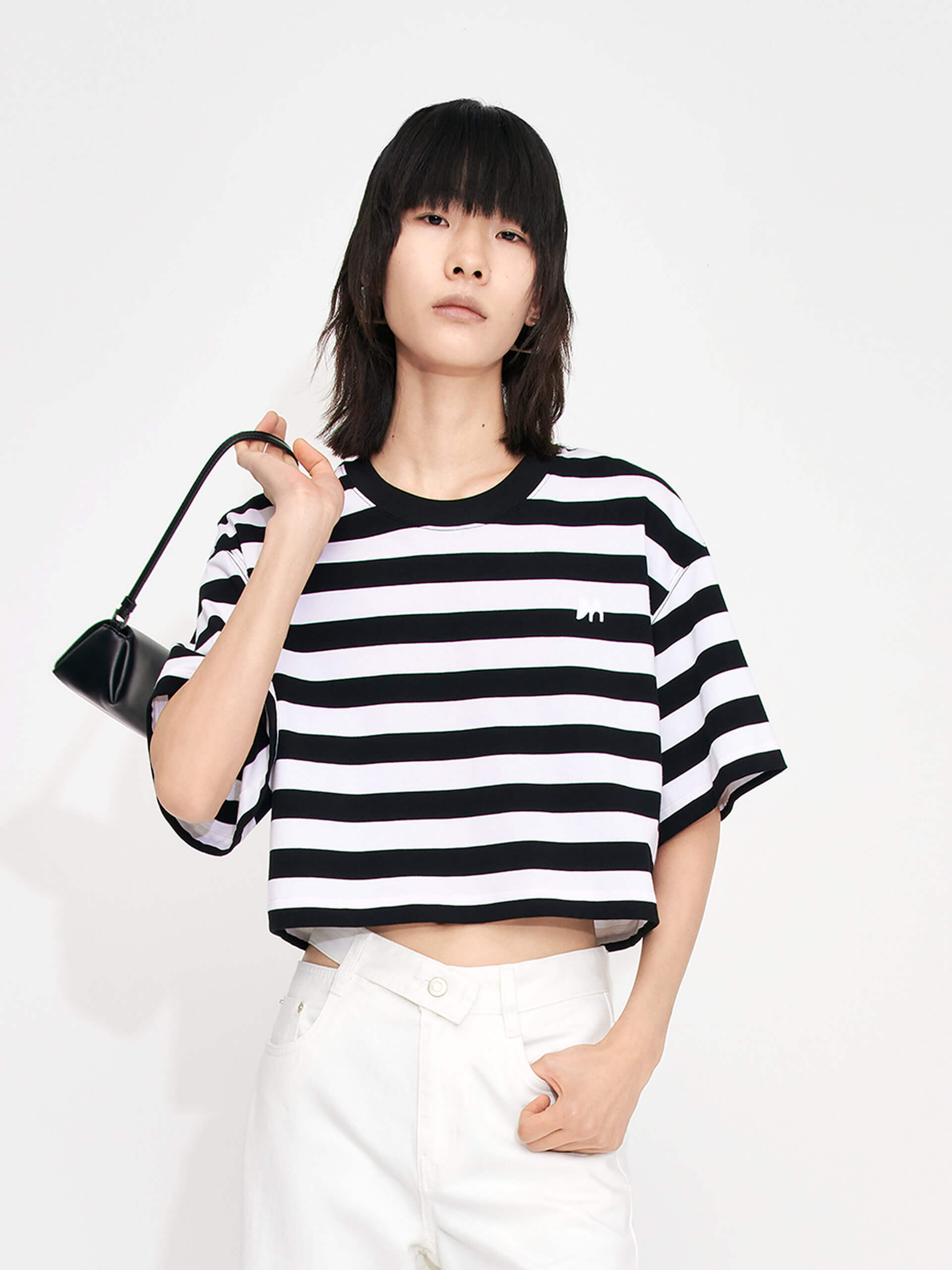 MO&Co. Women's Cropped Stripe Cotton T-shirt for summer casual days. Features a cropped, relaxed fit and classic black and white stripes