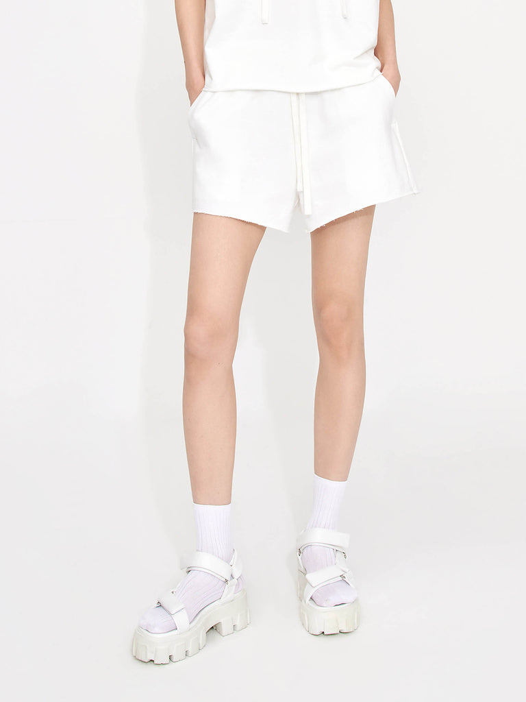 Stay in style and comfort with MO&Co.'s Women's Drawstring Waist Causal Shorts in White. Crafted from breathable cotton, the adjustable elastic waistband with drawstring provides a perfect fit every time, while the stylish double side pocket design allows for easy access to on-the-go items. Enjoy all-day comfort and style!