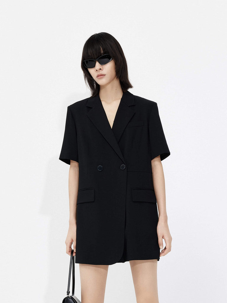 MO&Co. Women's V Neck Acetate Blend Blazer Romper in Black. Its double-breasted design provides a timeless silhouette, while its relaxed fit and V-neck complements your figure.