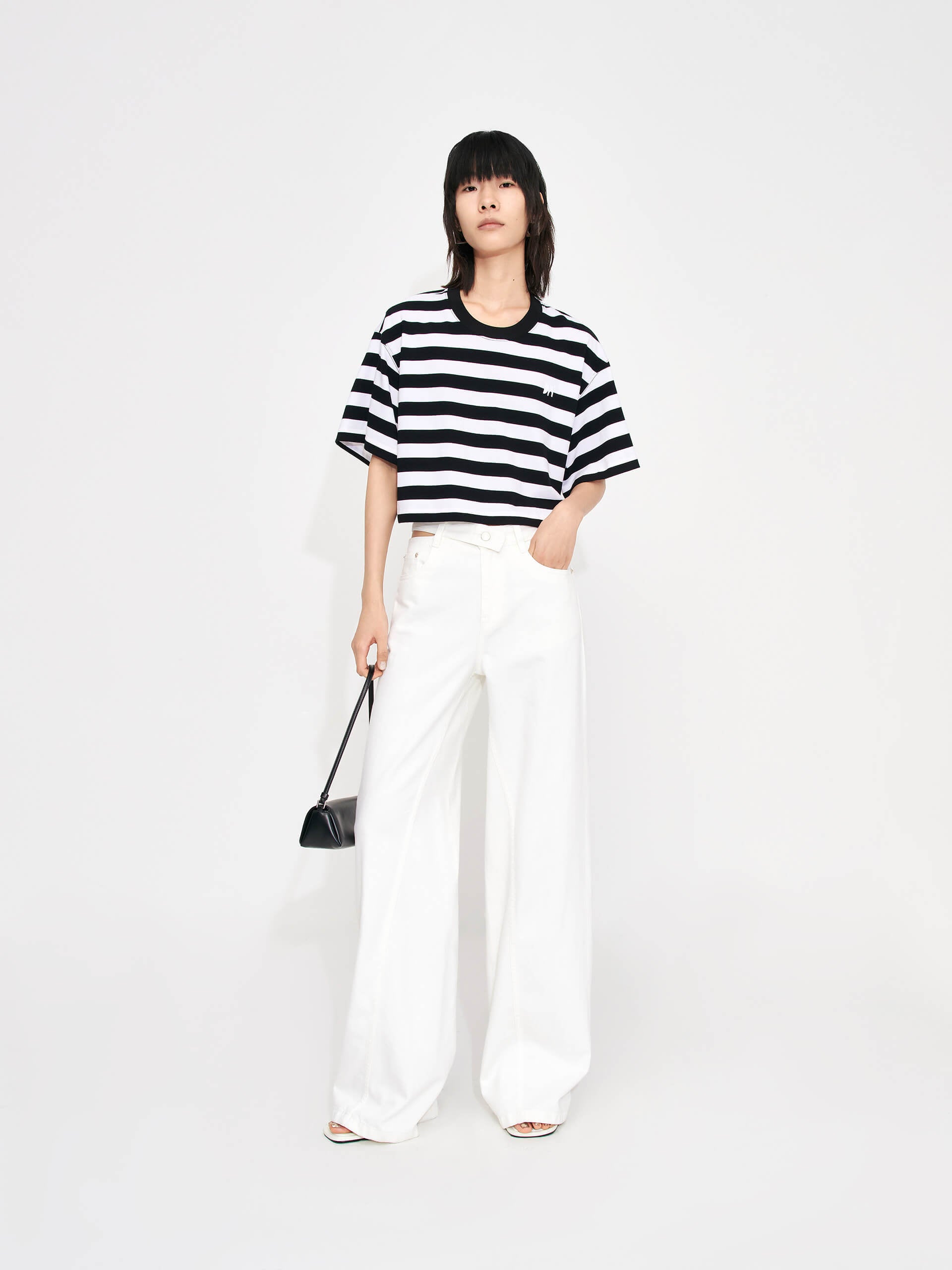 MO&Co. Women's Cropped Stripe Cotton T-shirt for summer casual days. Features a cropped, relaxed fit and classic black and white stripes