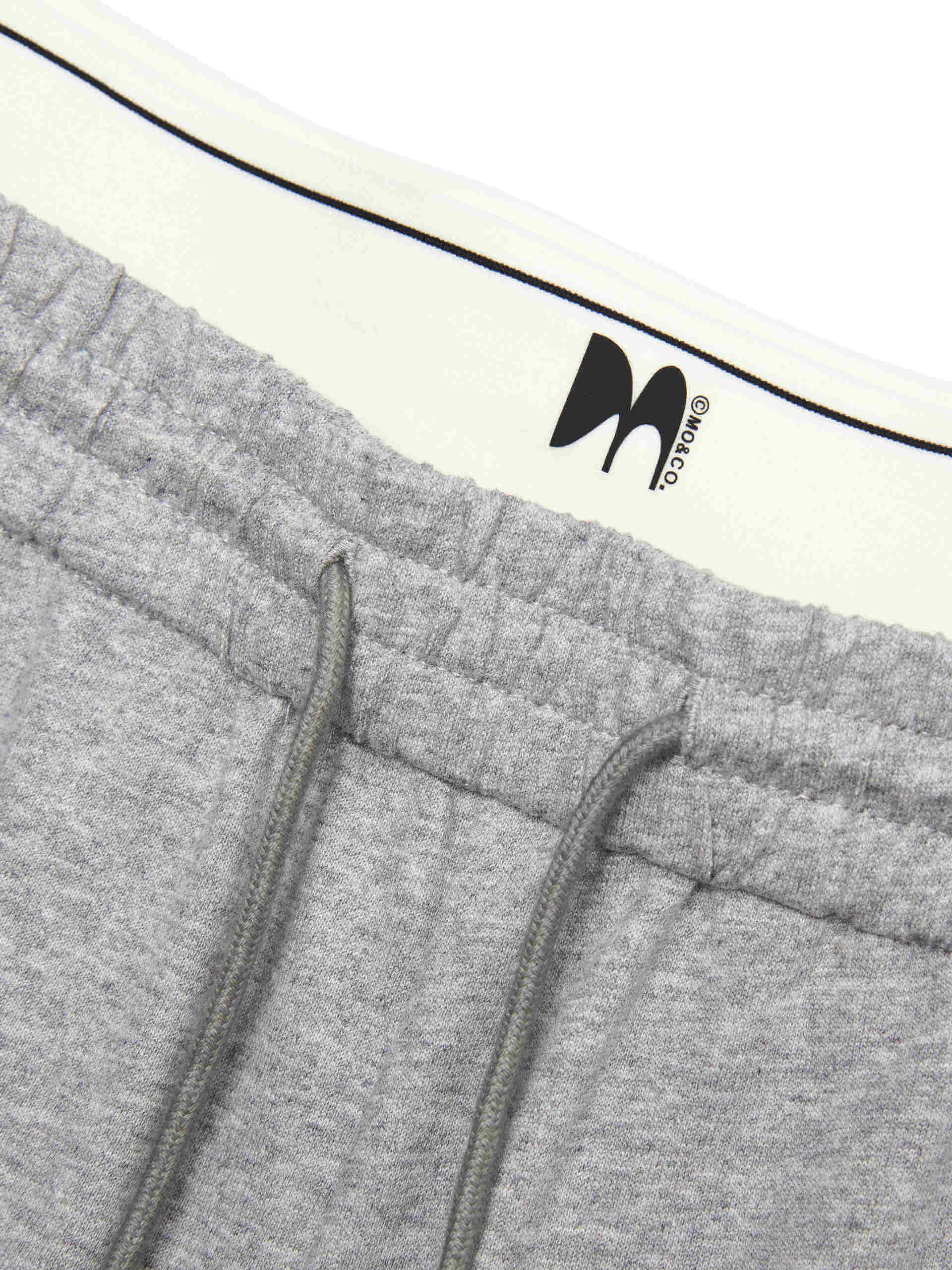 MO&Co. Women's Double Waistband Wide-leg Casual Trousers in Cotton - Grey. Made from breathable cotton fabric, these sweatpants offer a relaxed, stylish fit complete with wide legs & slant pockets. Contrast double waistbands & letter details give them added style.