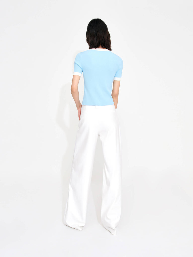 MO&Co. Women's Mid-rise Pleated Suit Pants in White. Cut with a wide, straight leg and pleats on the front, these chic pants have a zipper and hook closure, plus belt loops for an extra polished look.
