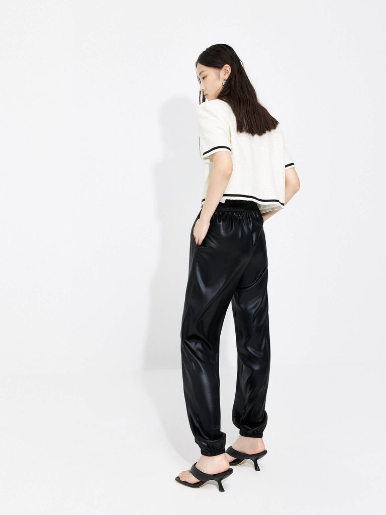 MO&Co. Women's Triacetate Blend Elastic Waist Jogger Pants in Black with Side Slant Pockets, an Elasticated Waist with Woven Label Front Details, and an Elasticized Hem!