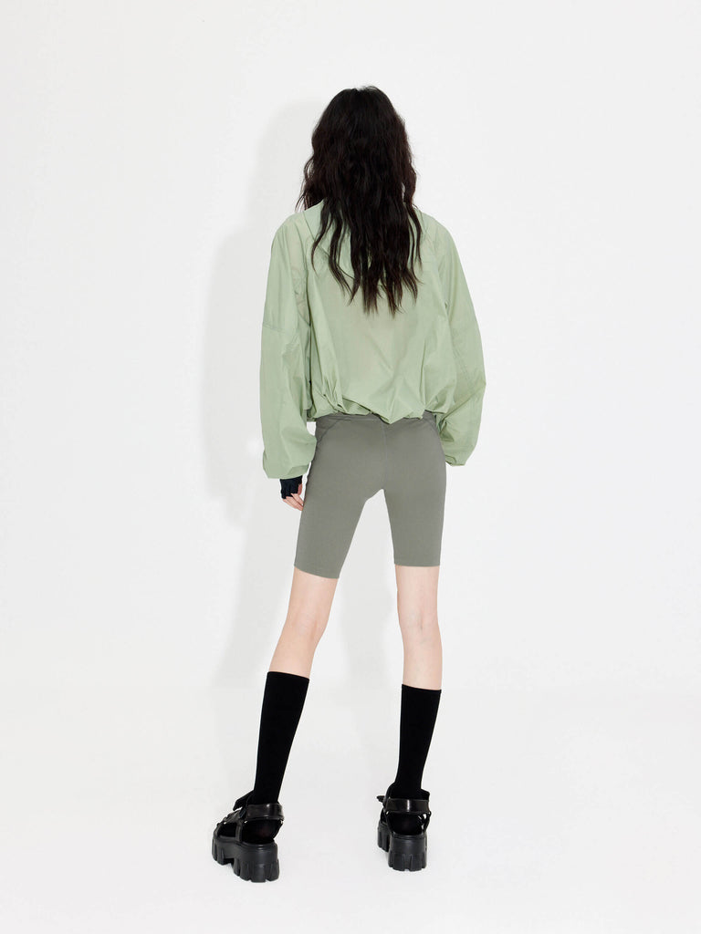 Try MO&Co.'s High Waist Sports Shorts in Olive for women! These biker shorts hug your shape, thanks to stretchy material that moves with you. Plus, they feature a high rise with an elasticized waistband.