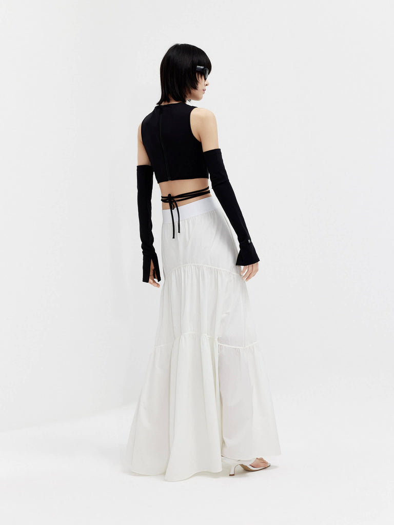 MO&Co. Women's Flowy Prairie Maxi Skirt in White for Summer Day features double side pockets, cool-touch fabric, an elasticized waistband, and gathered seam details for a perfect fit.