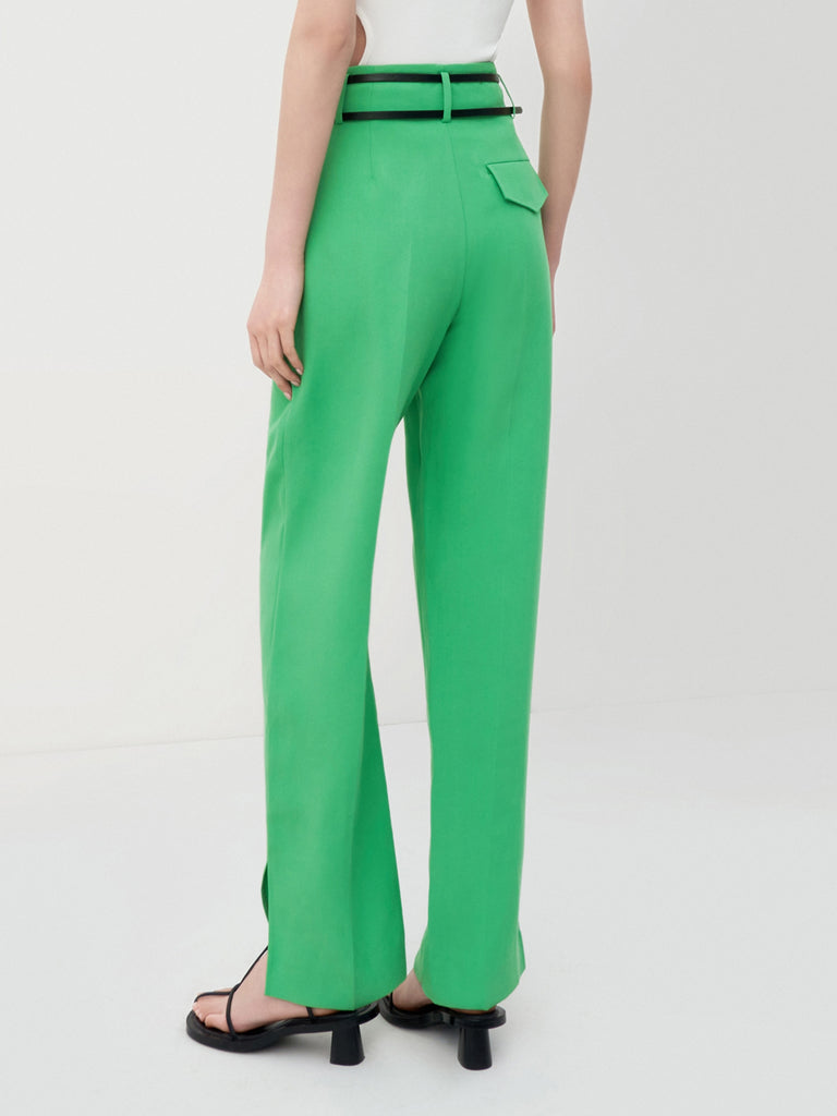 MO&Co. Women's Pleated Suit Pants with Belt in Green features high-rise, slit detail at hems, straight leg fit.