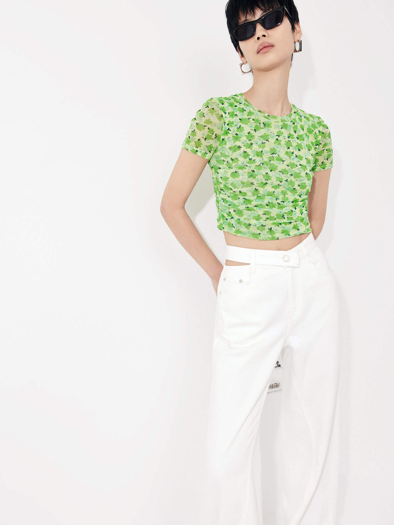Stay stylish and comfortable with MO&Co.'s Floral Print Pleated Crop Top in Green. Crafted with lightweight mesh fabric and pleated side details, this top will flatter your shape while the fresh floral print adds an elegant touch.