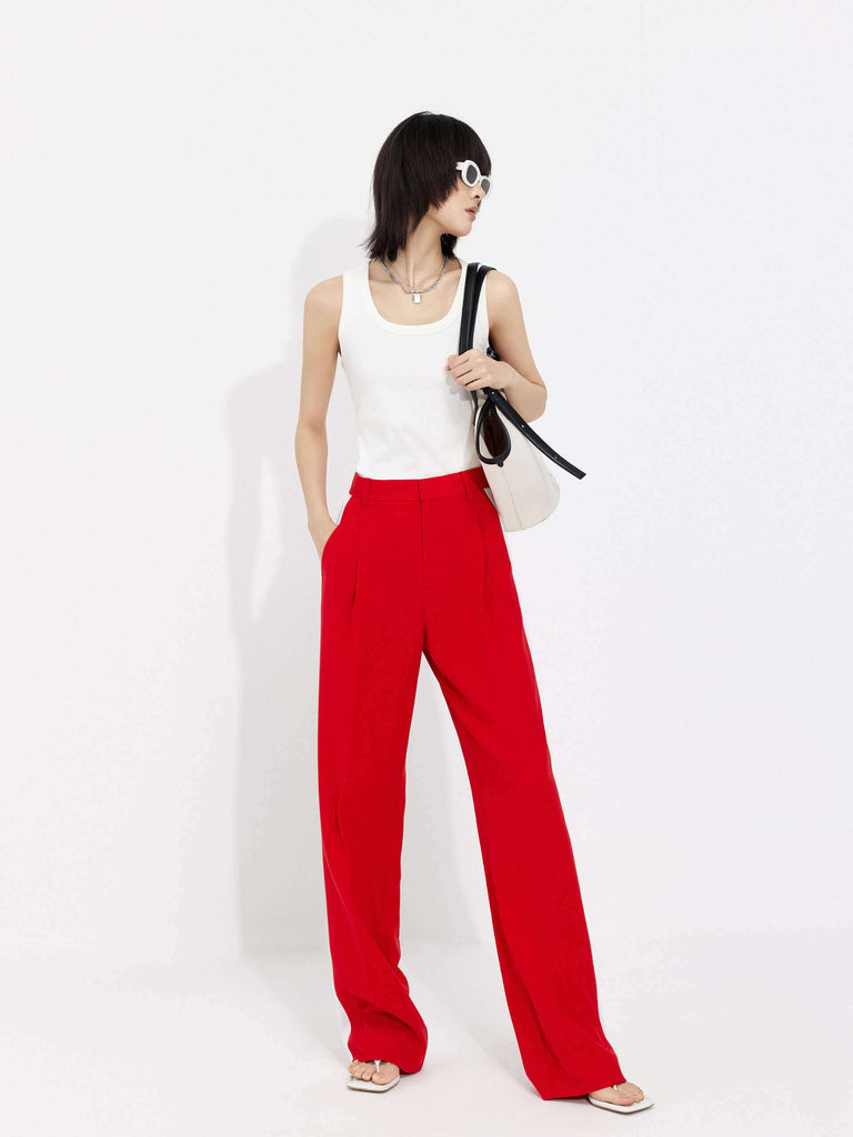MO&Co. Women's Contrast Trim Suit Pants in Red offer timeless style and lasting comfort. Features include contrast trim design, straight leg, side pockets, belt loops, and a zipper and hook closure.