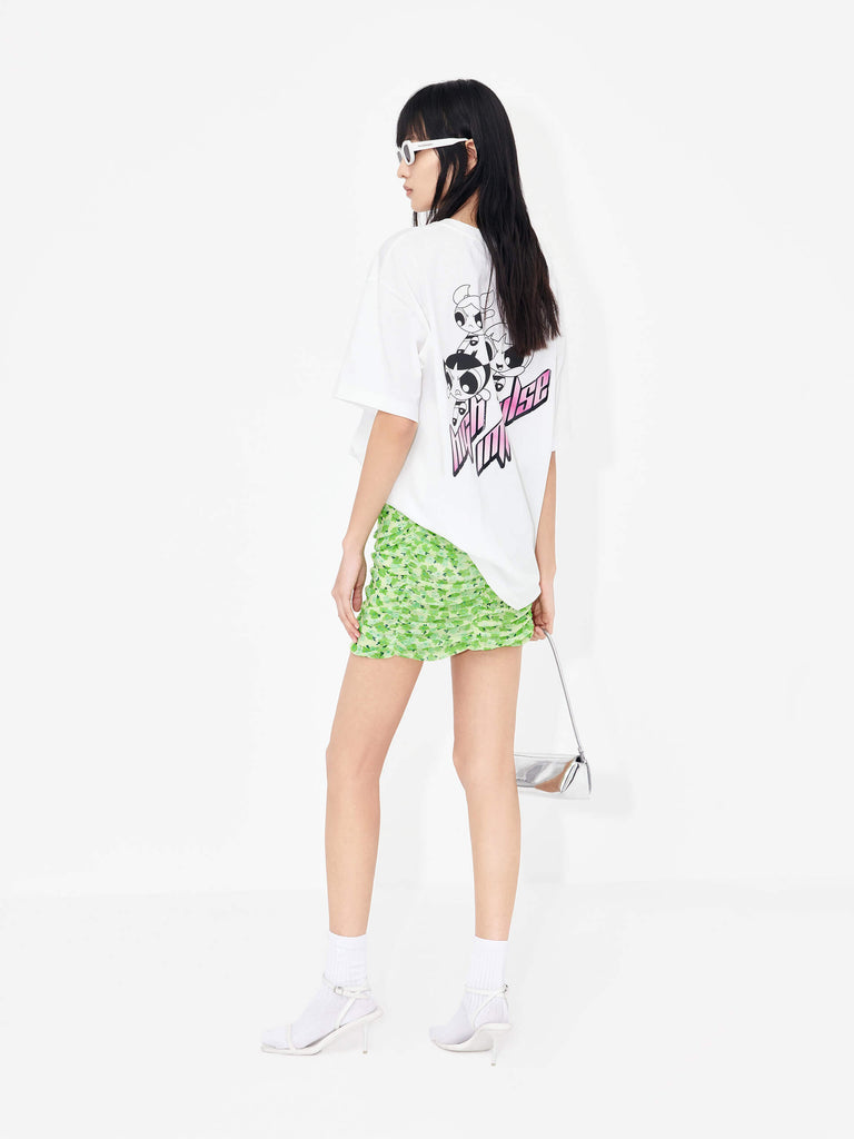 The MO&Co Women's Pleated Floral Print Mini Skirt in Green is a stylish wardrobe staple perfect for a polished look. Crafted from lightweight mesh with a pleated design, it features a classic flower print and draped detailing. A hidden side zipper and inner lining provide a comfortable, secure fit.