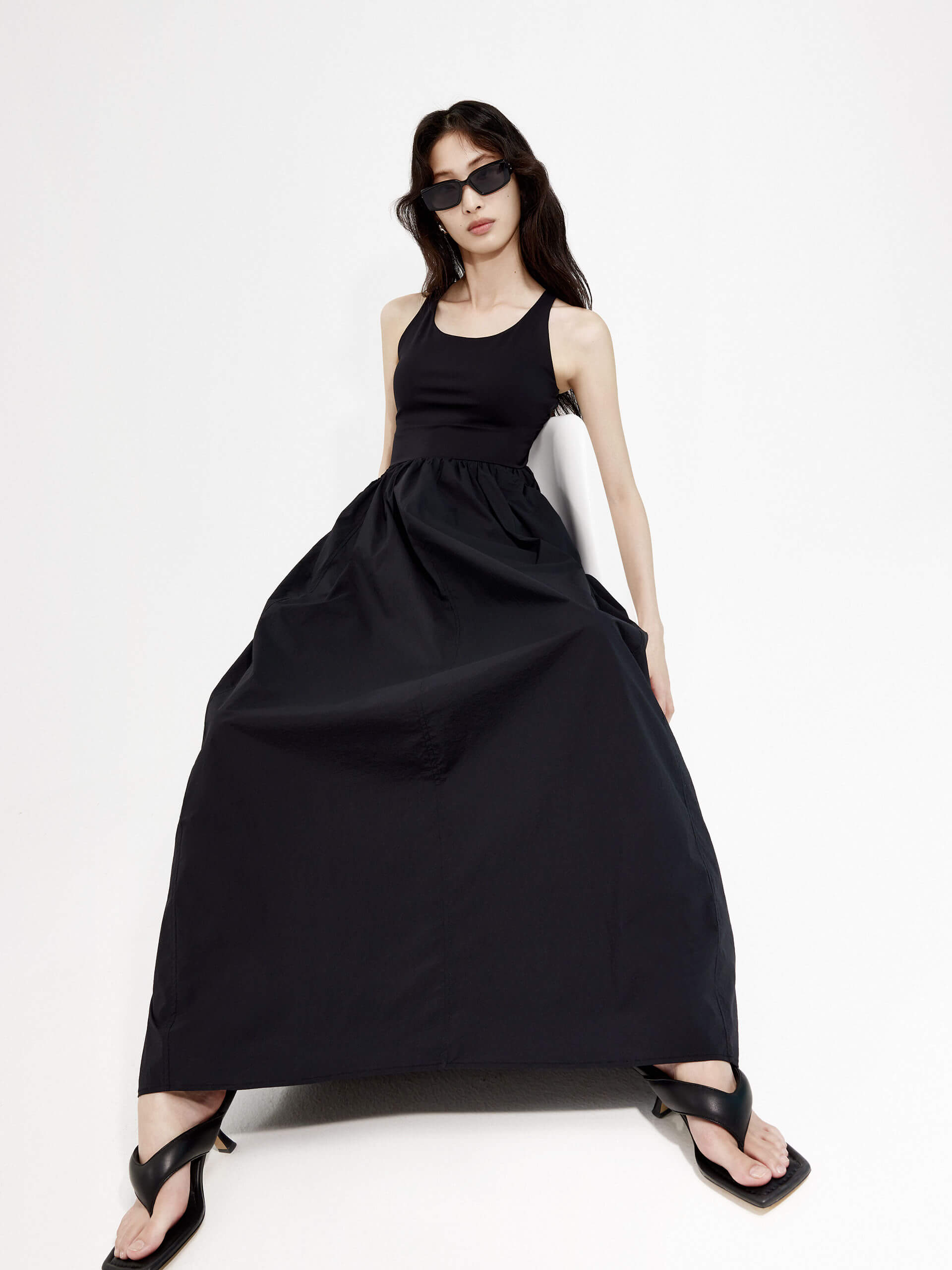 MO&Co. Women's Athleisure Contrast Panel Cutout Dress in Black features sleeveless, racerback silhouette and maxi length.