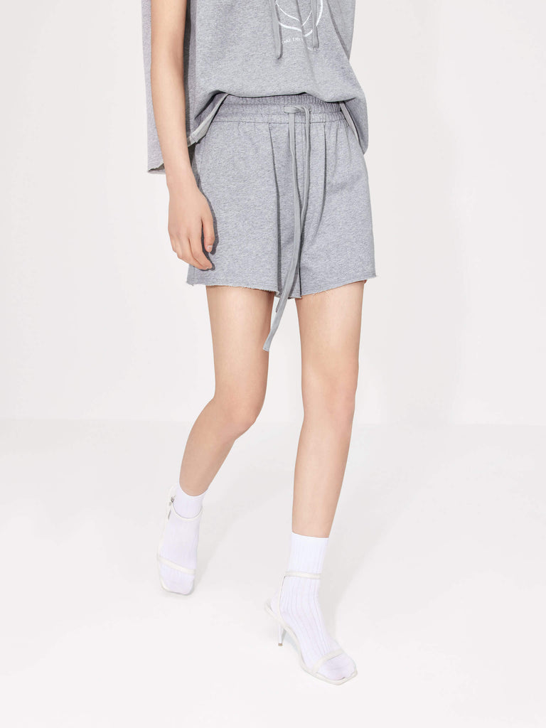 Stay in style and comfort with MO&Co.'s Women's Drawstring Waist Causal Shorts in Grey. Crafted from breathable cotton, the adjustable elastic waistband with drawstring provides a perfect fit every time, while the stylish double side pocket design allows for easy access to on-the-go items. Enjoy all-day comfort and style!